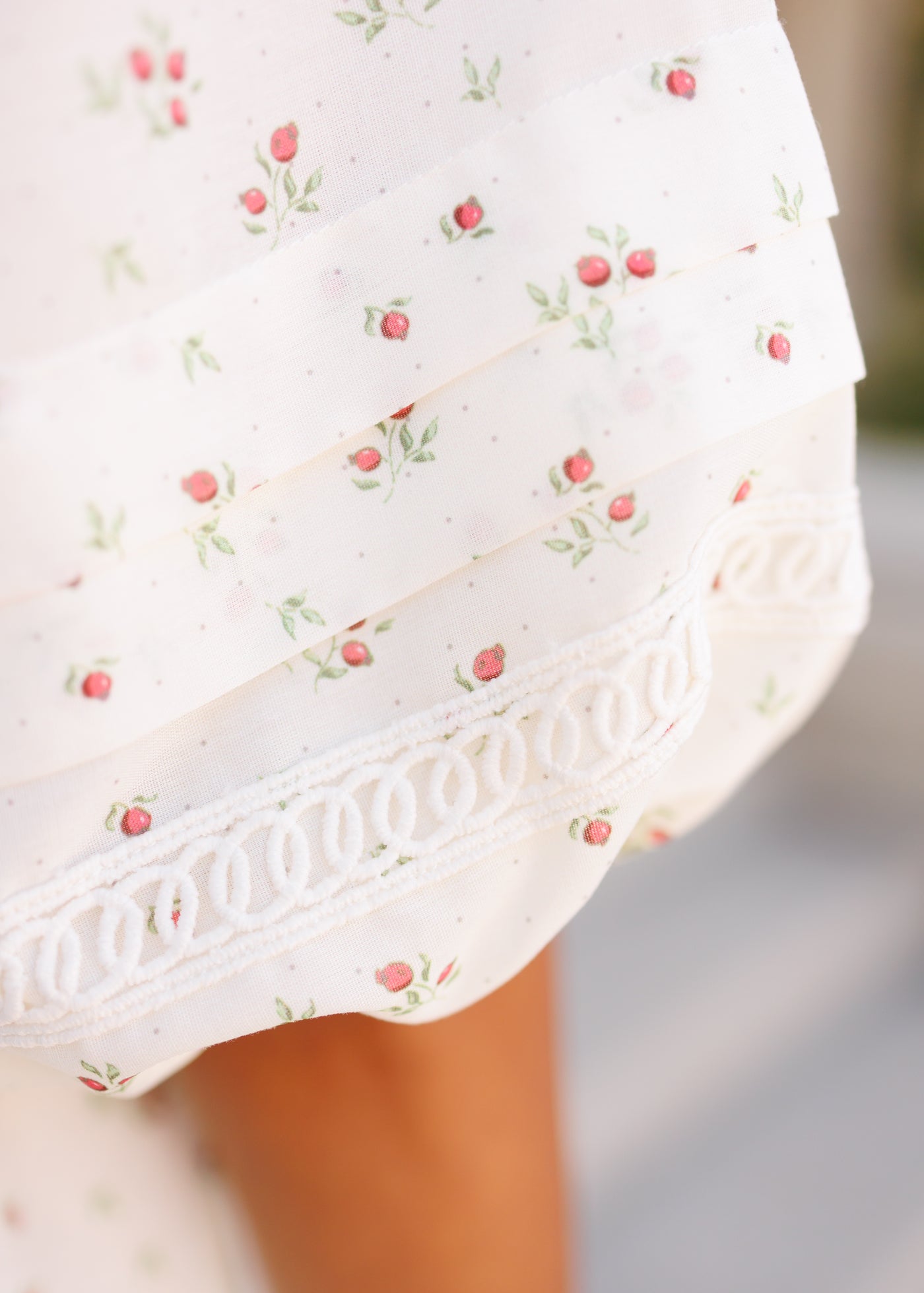 Close up of the sleeve detail on the ivory floral dress