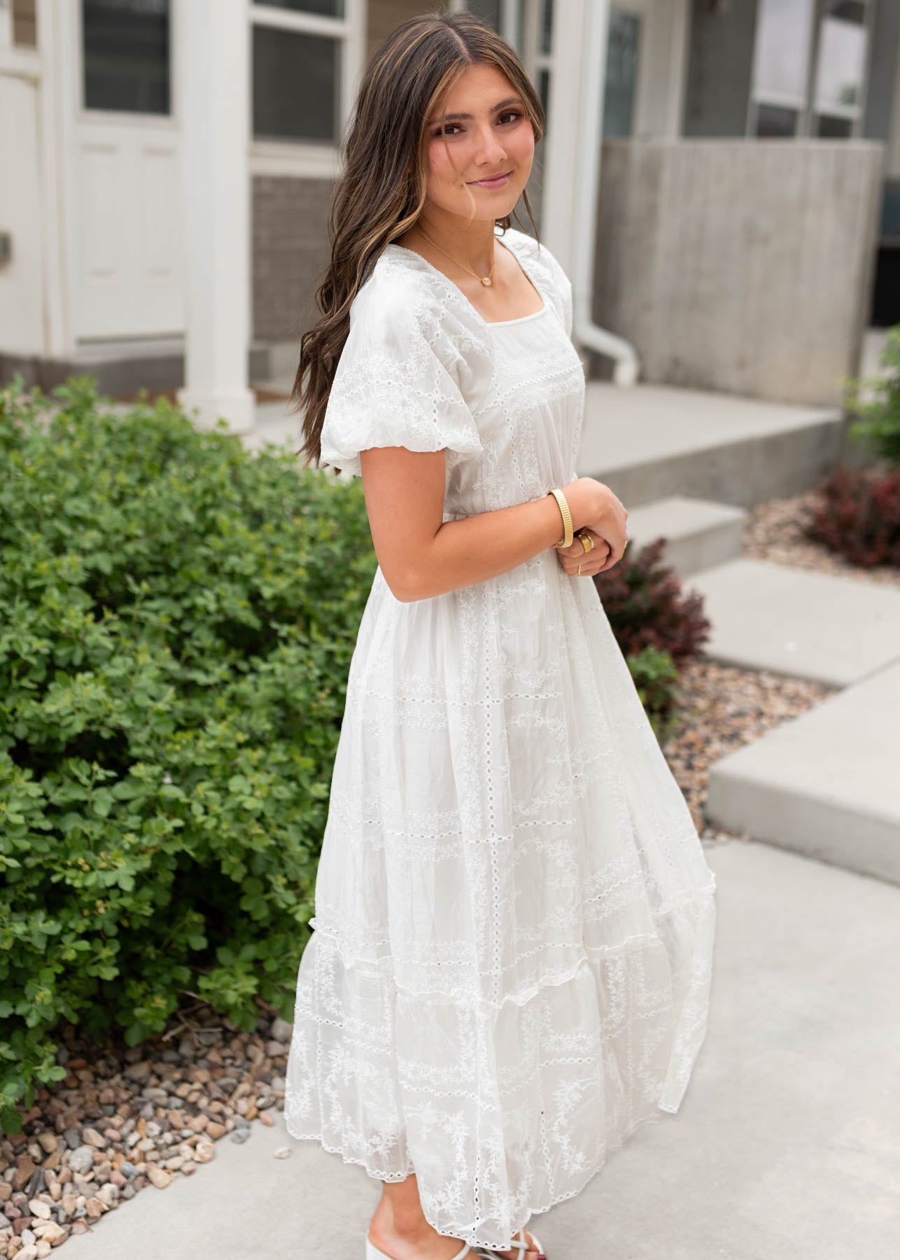 Side view of the white embroidered dress