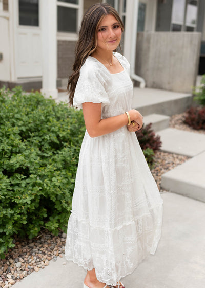 Side view of the white embroidered dress
