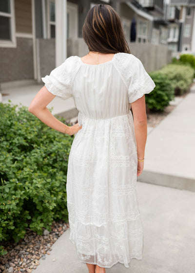 Back view of the white embroidered dress