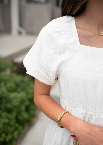 Close up of the fabric on the white embroidered dress