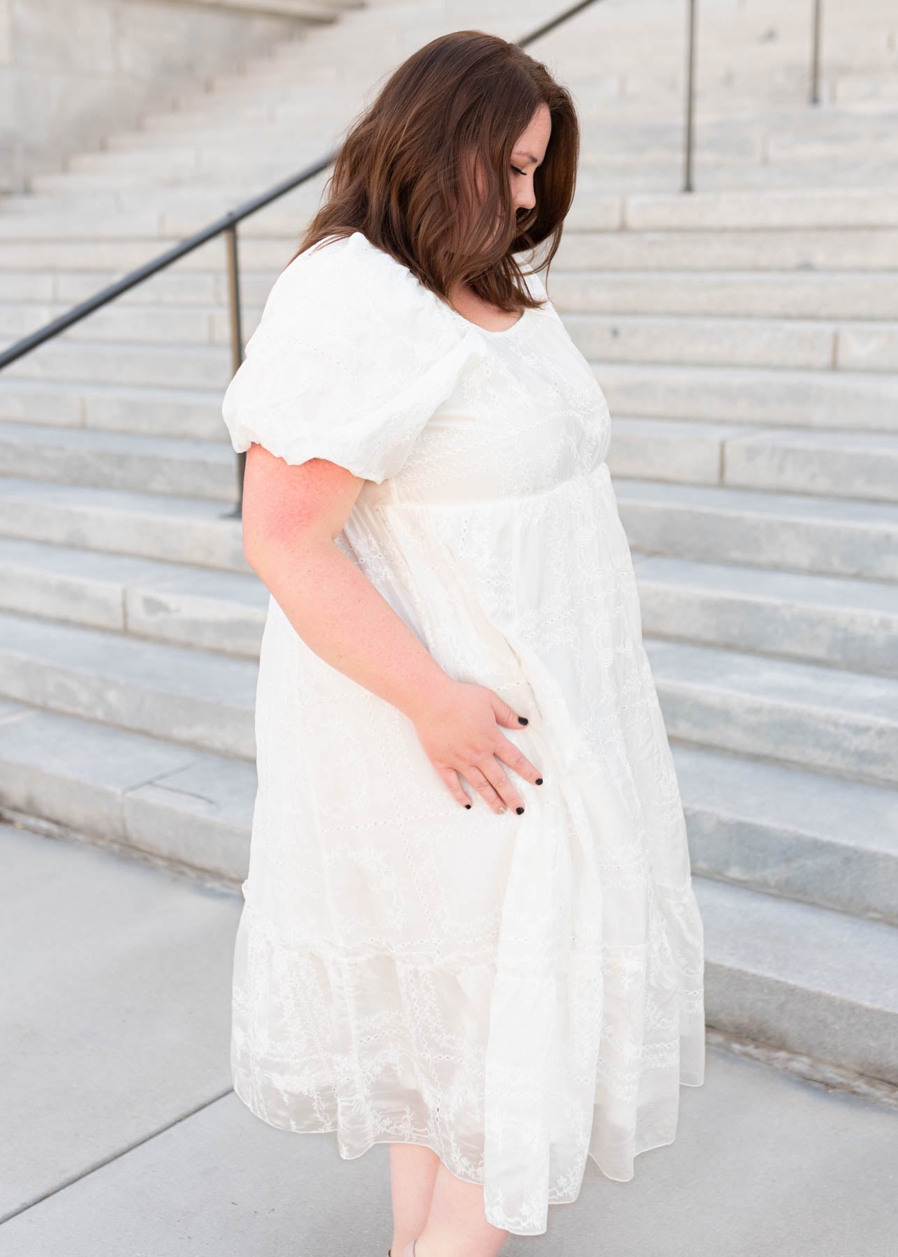 Side view of the plus size white embroidered dress