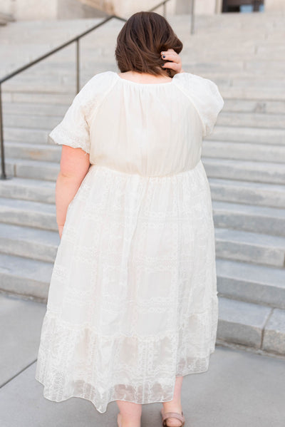 Back view of the curvy white embroidered dress