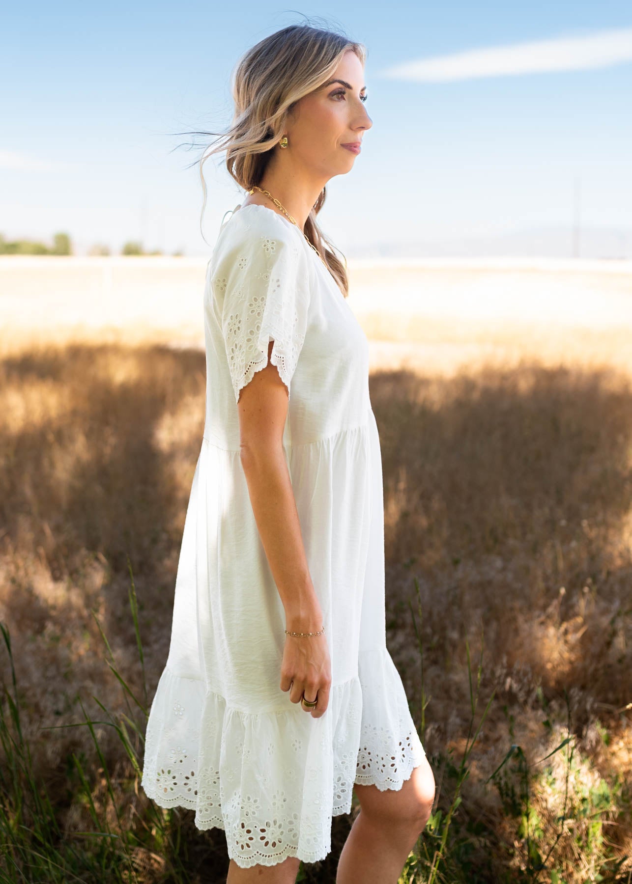 Side view of the ivory eyelet sleeve dress