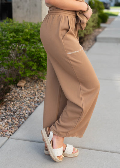 Side view of the brown waffle knit bottom with elastic waist