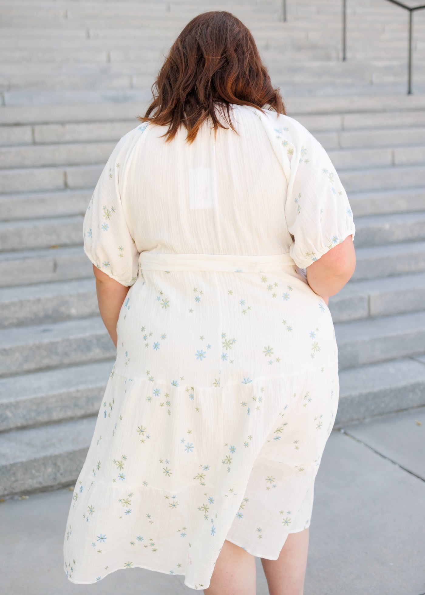 Back view of the white flower embroidered dress in plus size