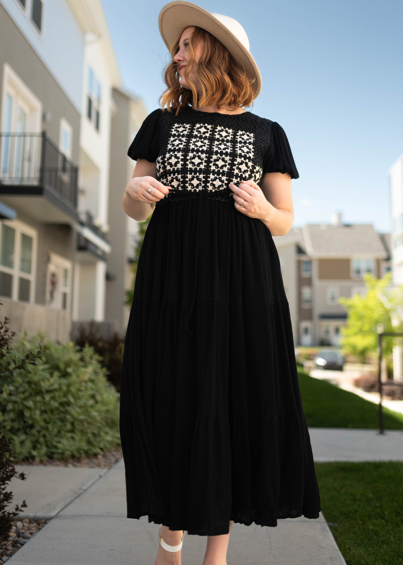 Black dress with short sleeves and tan and black crocheted top