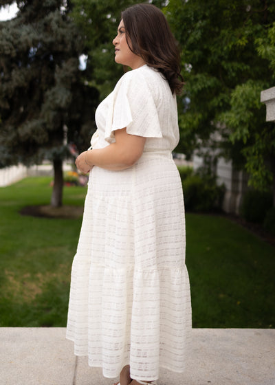 Modest side view of the ivory textured tie dress at Lena Layne