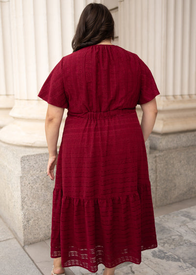 Back view of the modest plus size maroon textured tie dress with a little bit of elastic