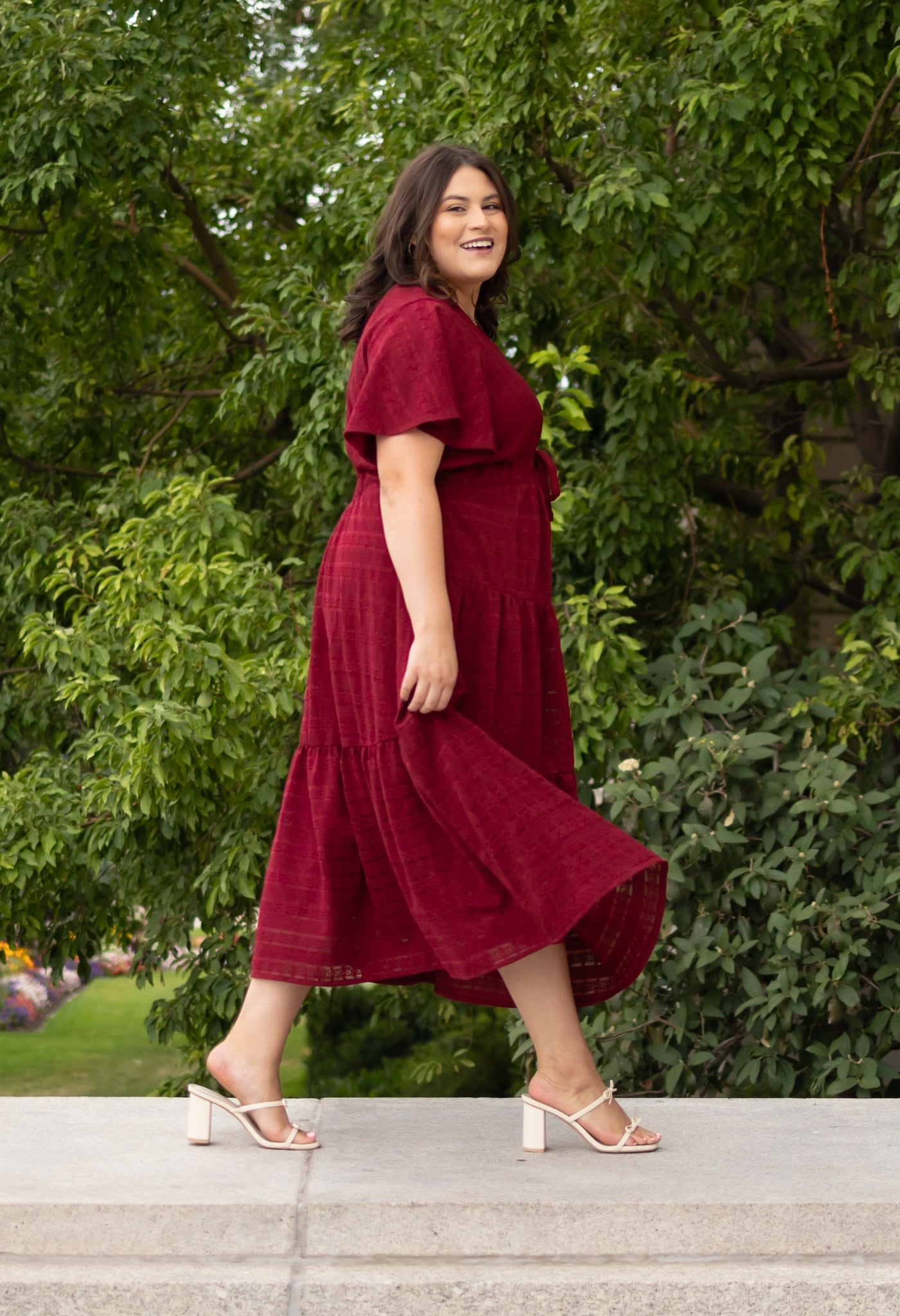 Side view of the mddest plus size maroon textured tie dress at lena layne