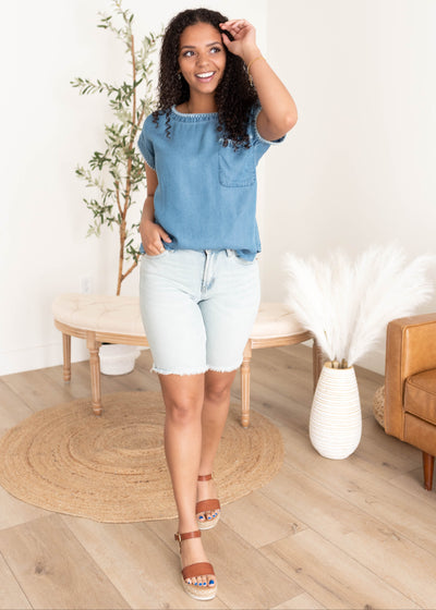 Embroidered enim top with fron pocket