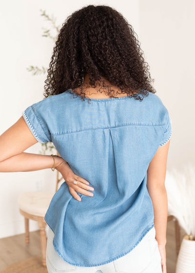 Back view of the embroidered denim top