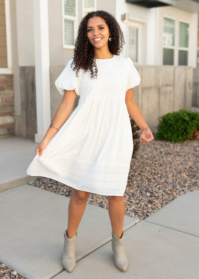 White embroidered dress with puff sleeves