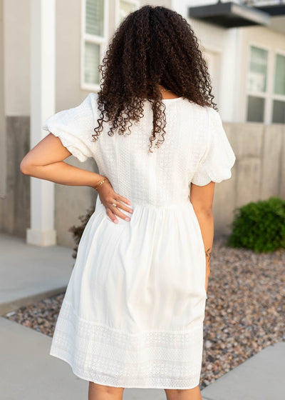 Back view of the white embroidered dress