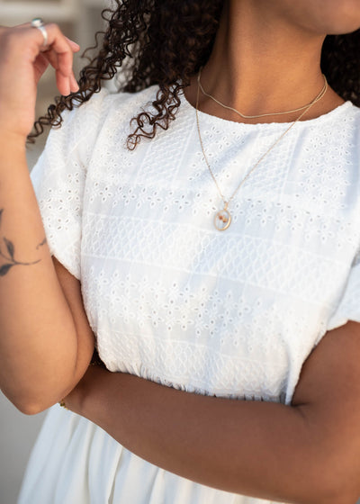 Close up of the fabric on the white embroidered dress