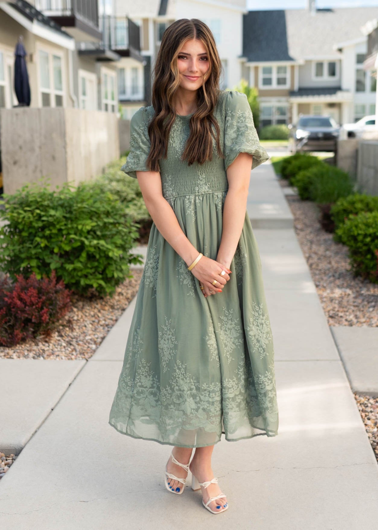 Smocked bodice on the deep sage embroidered dress