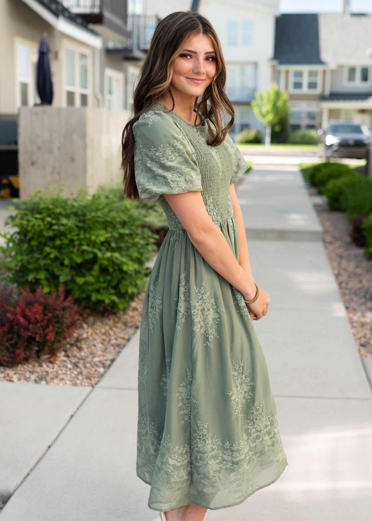 Side view of the deep sage embroidered dress