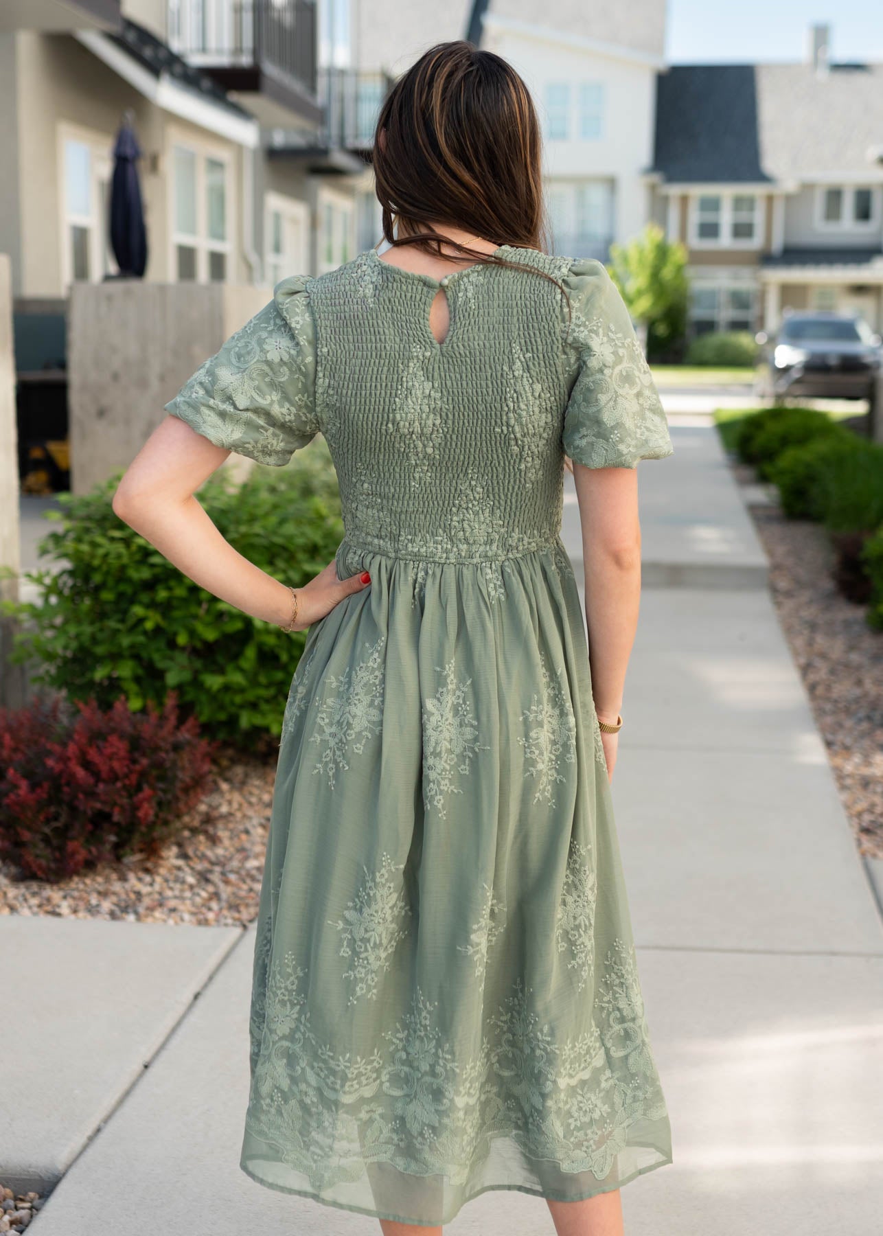 Back view of the deep sage embroidered dress