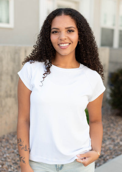 Cap sleeve on the white reaglen top