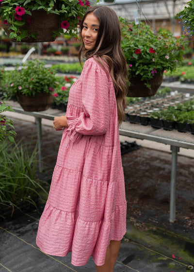 Side view of the pink long sleeve dress
