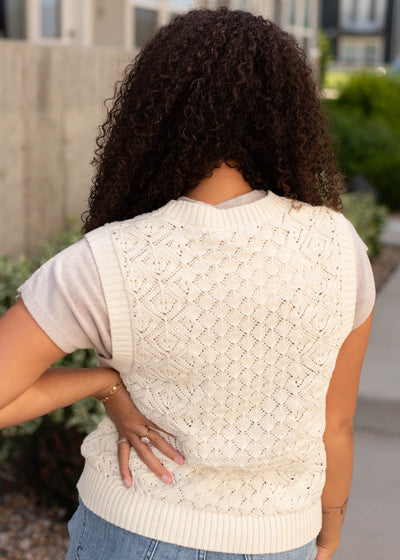 Back view of the cream knit sweater vest