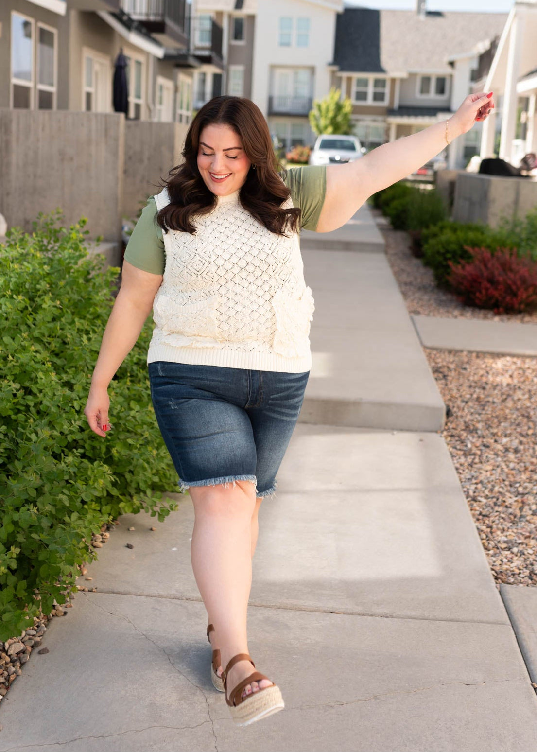 Plus size cream knit sweater vest with front pockets