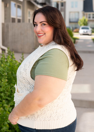Side view of the plus size cream knit sweater vest
