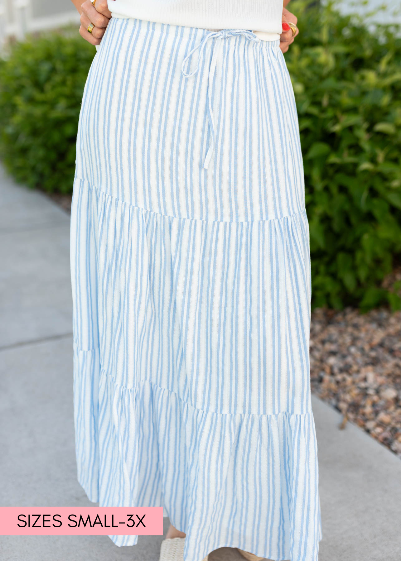 Tiered blue pinstripe skirt with a tie at the waist