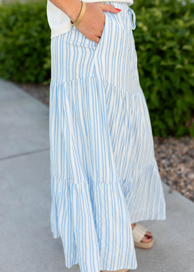 Side view of the blue pinstripe skirt with pockets