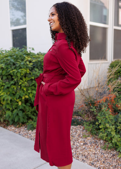 Side view of the long sleeve modest burgundy button up dress