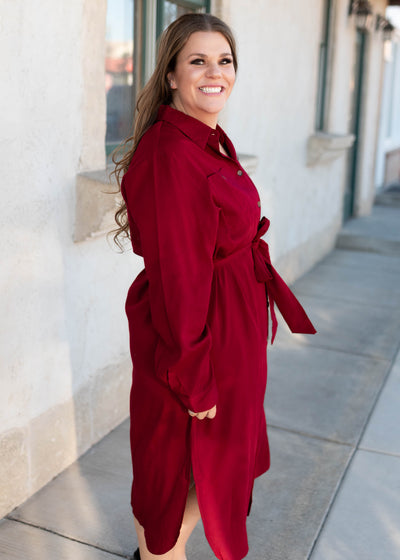 Side view of the plus size burgundy button up dress