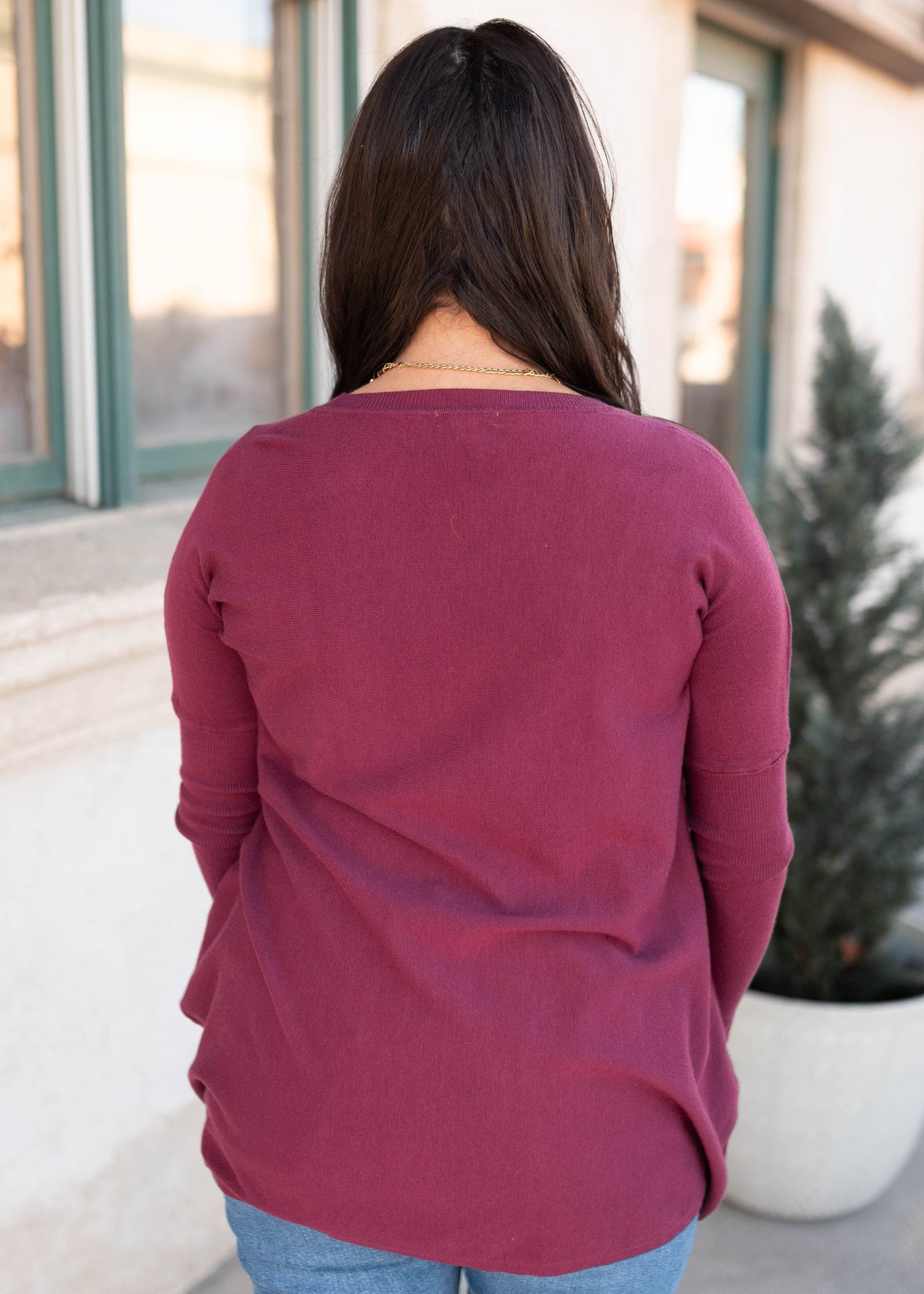 Back view of the burgundy pocket sweater