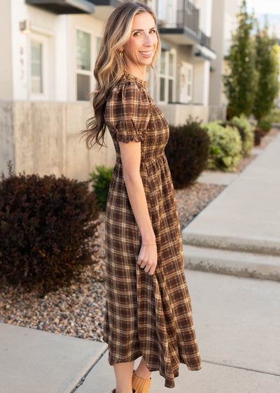 Side view of the modest brown gingham smocked dress
