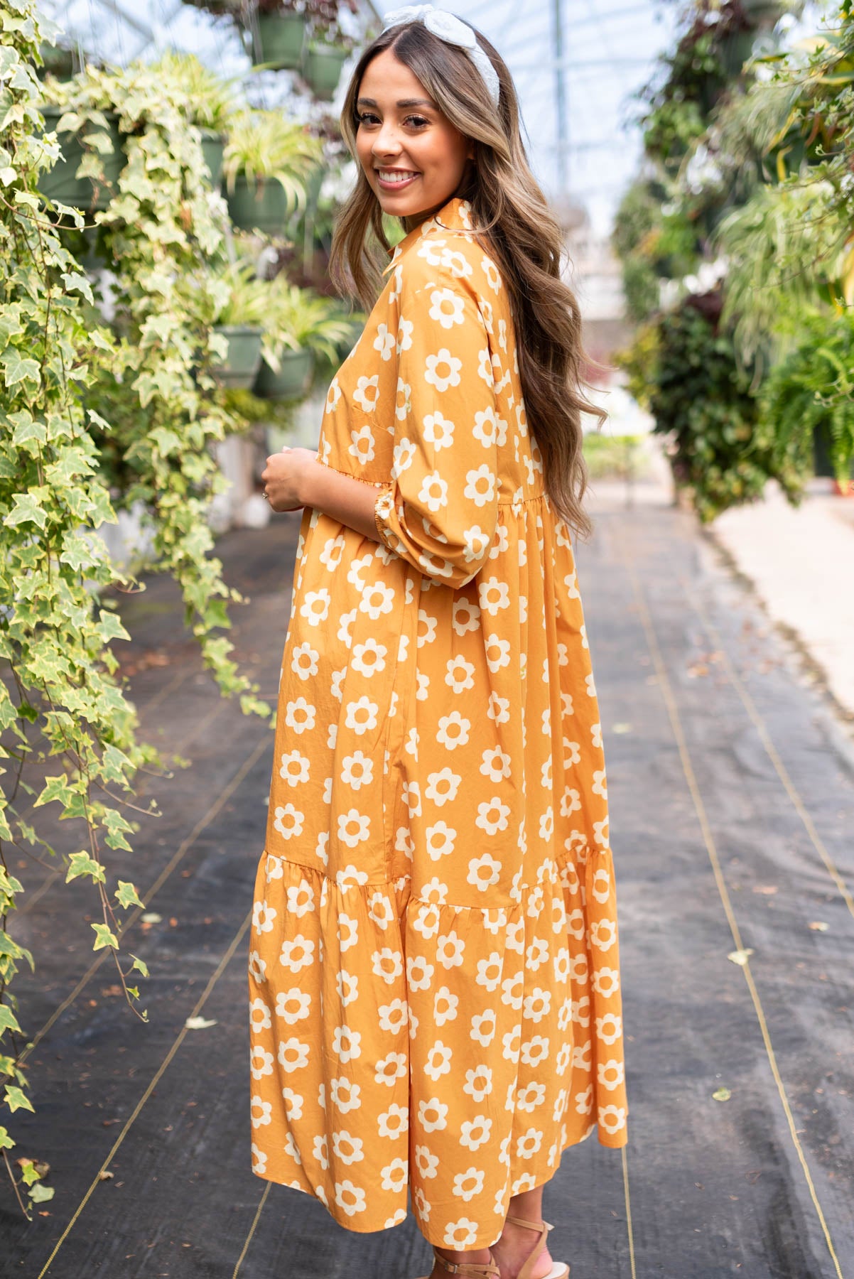 Side view of the golden floral dress