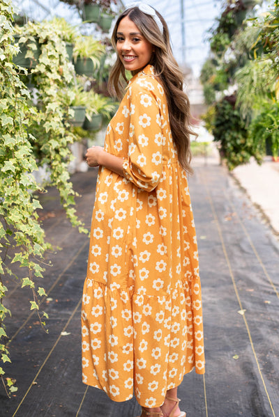 Side view of the golden floral dress
