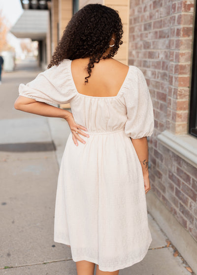 Back view of the cream square neck dress
