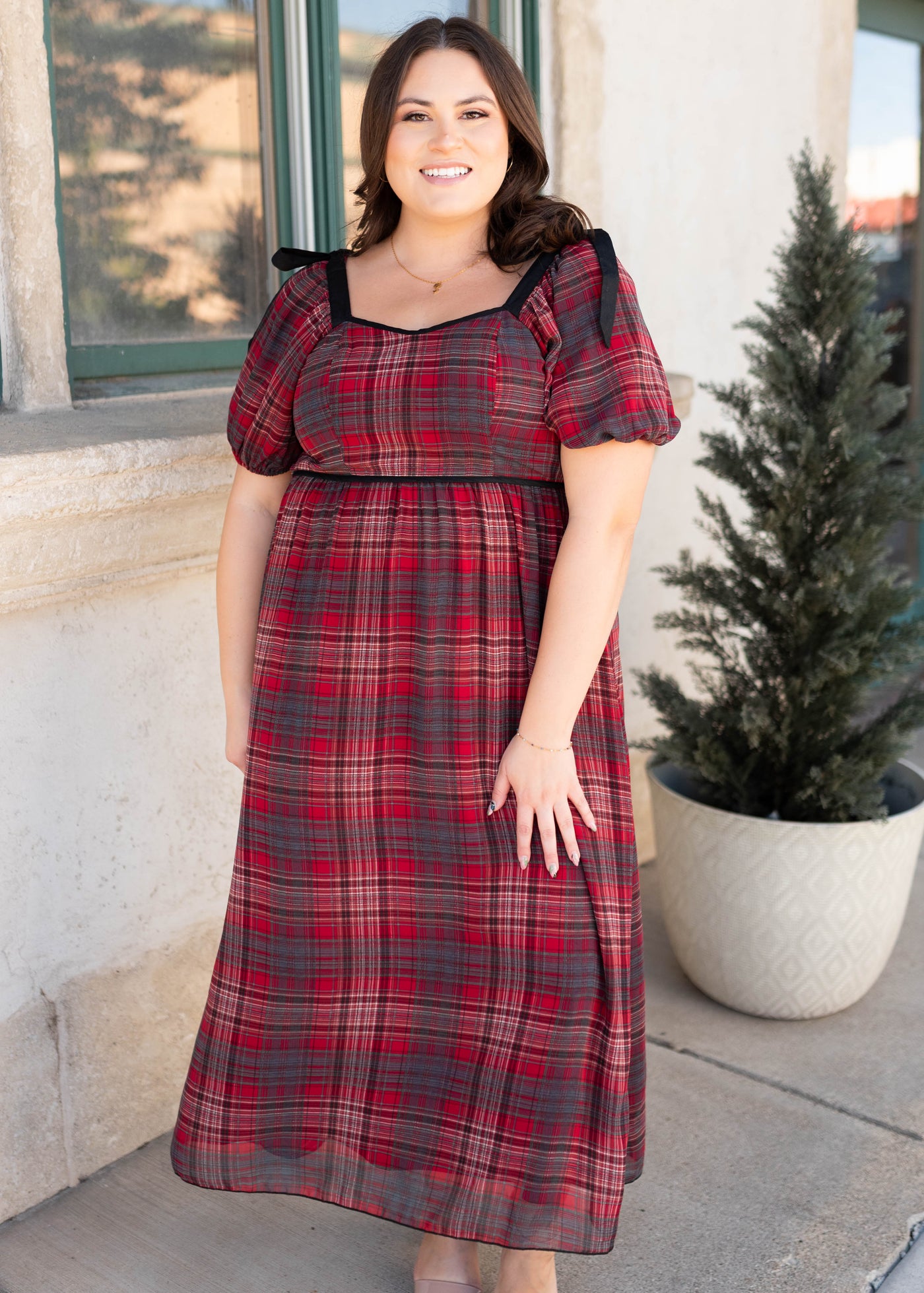 Plus size red plaid bow dress with black bows on the shoulders by Lena Layne