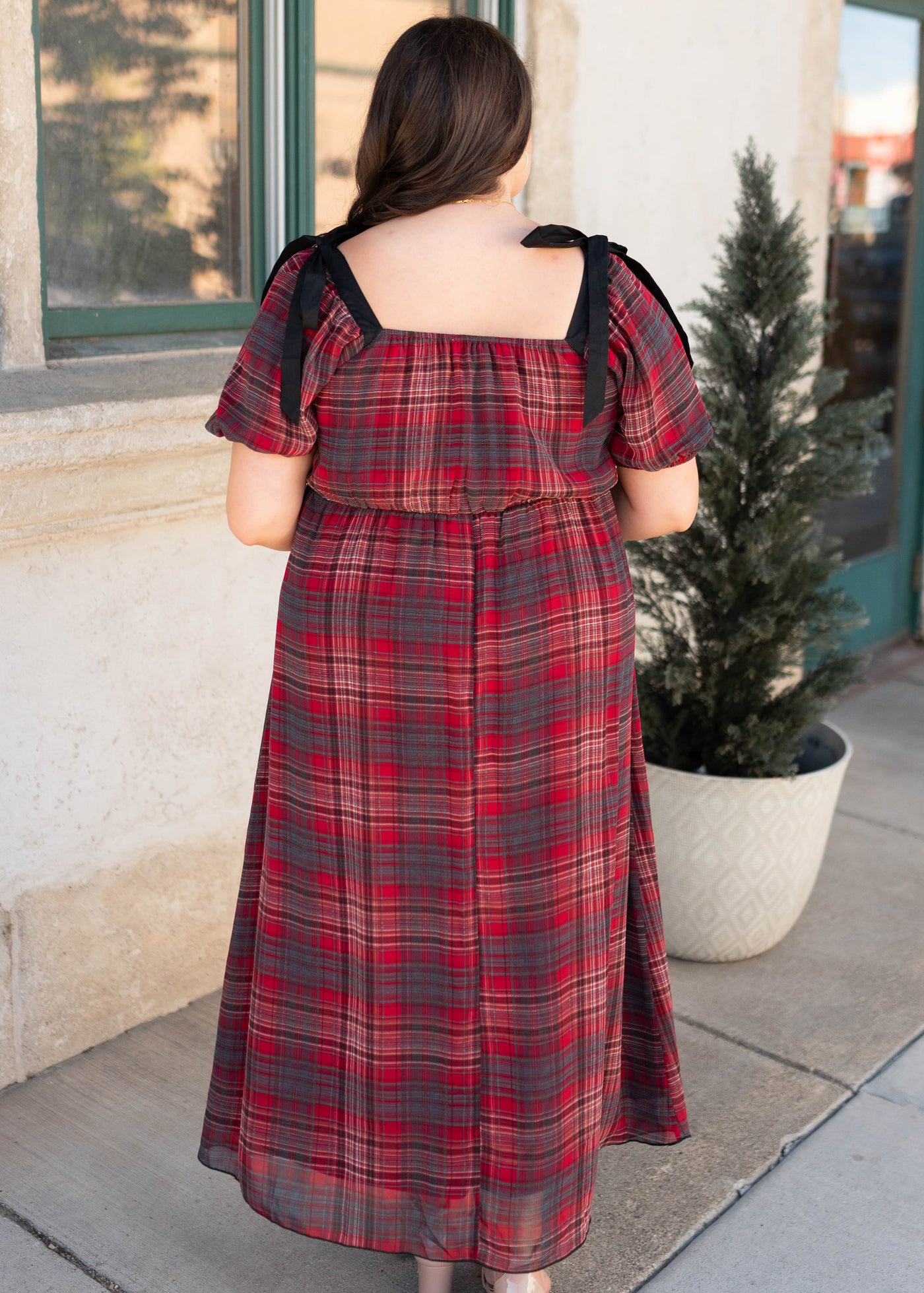 Back view of the plus size red plaid bow dress