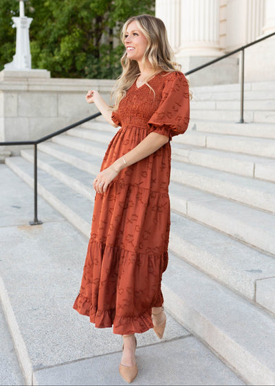 Side view of the modest sienna smocked dress with a tiered skirt sold at Lena Layne