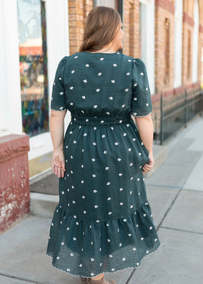 Back view of the dark teal floral dress