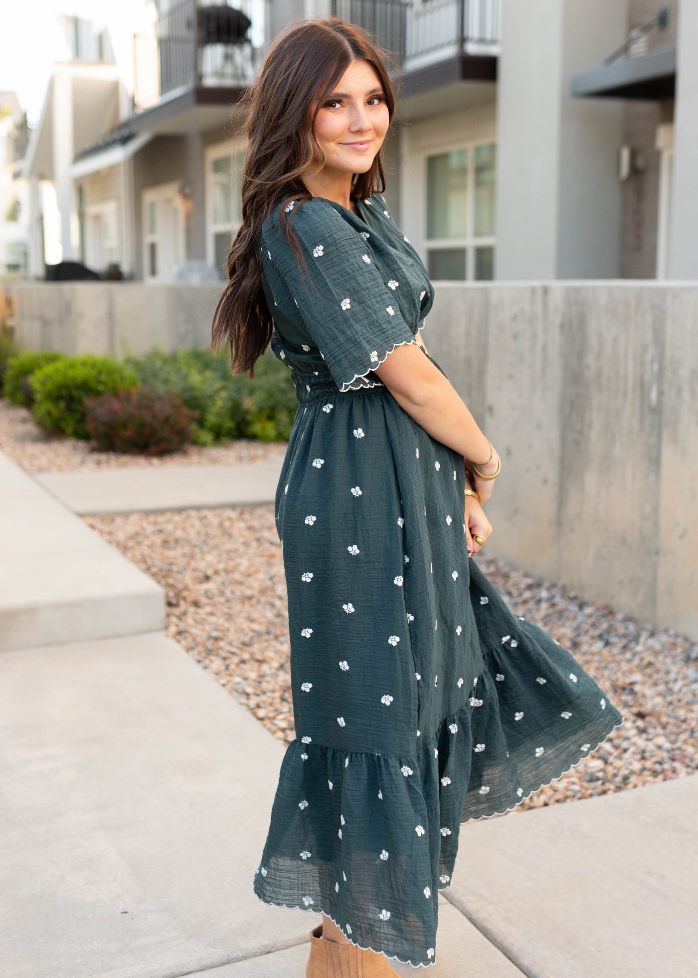 Side view of the modest dark teal floral dress