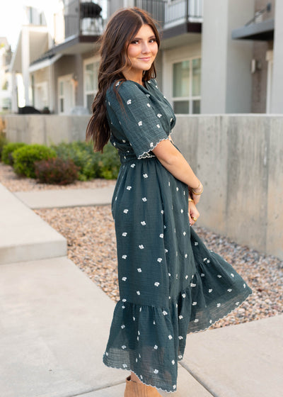 Side view of the modest dark teal floral dress