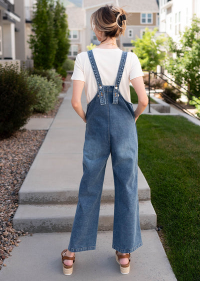 Back view of the denim overalls