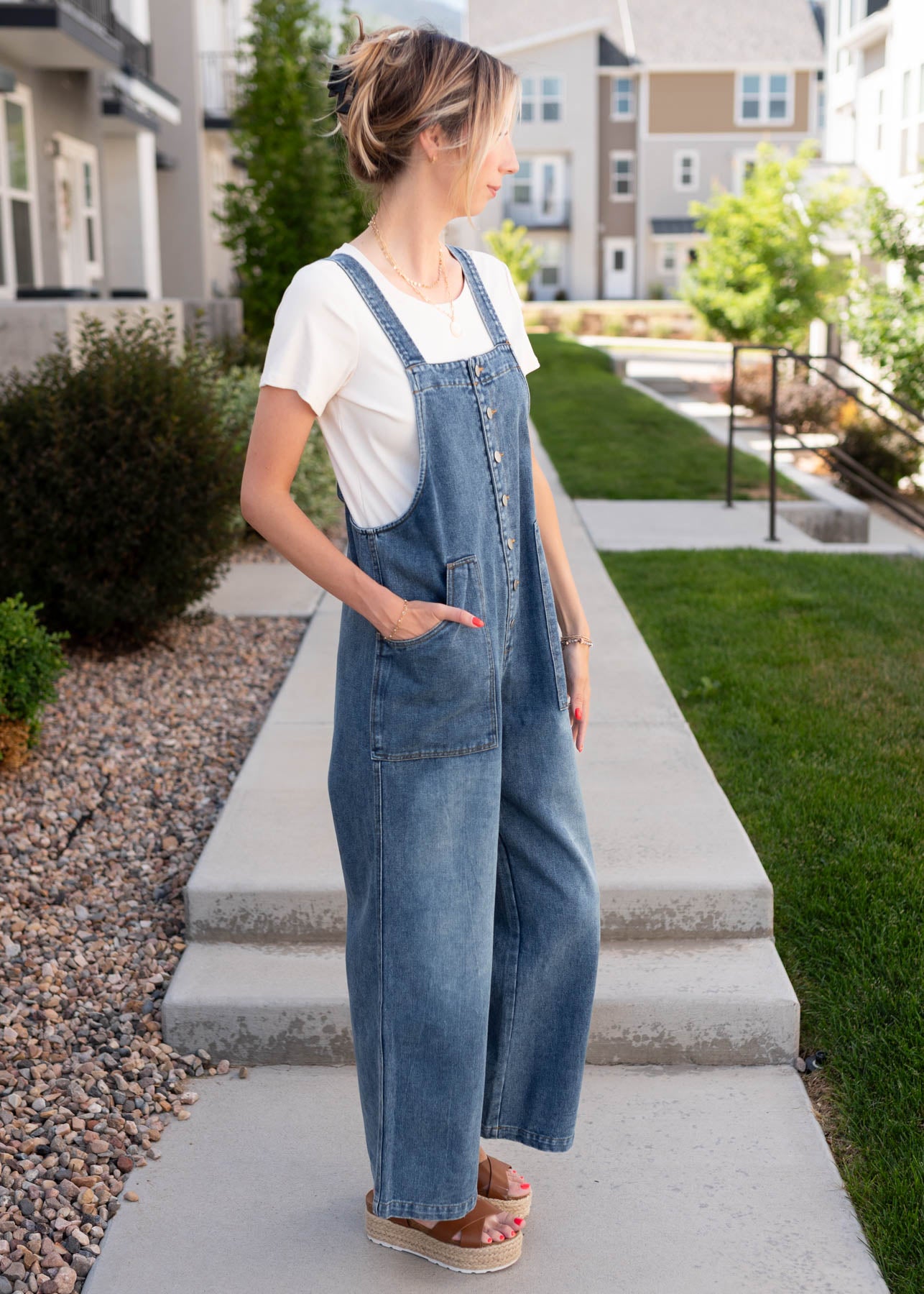 Side view of the denim overalls