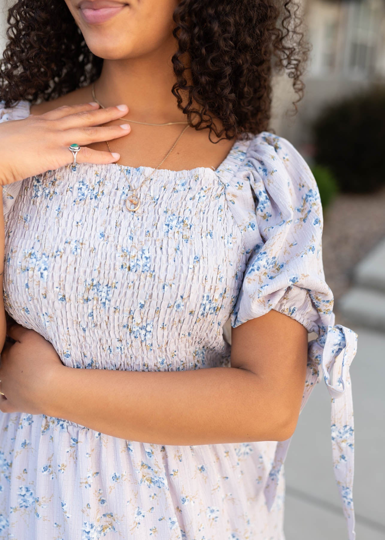 Close up of the smocking on the lavender floral dress