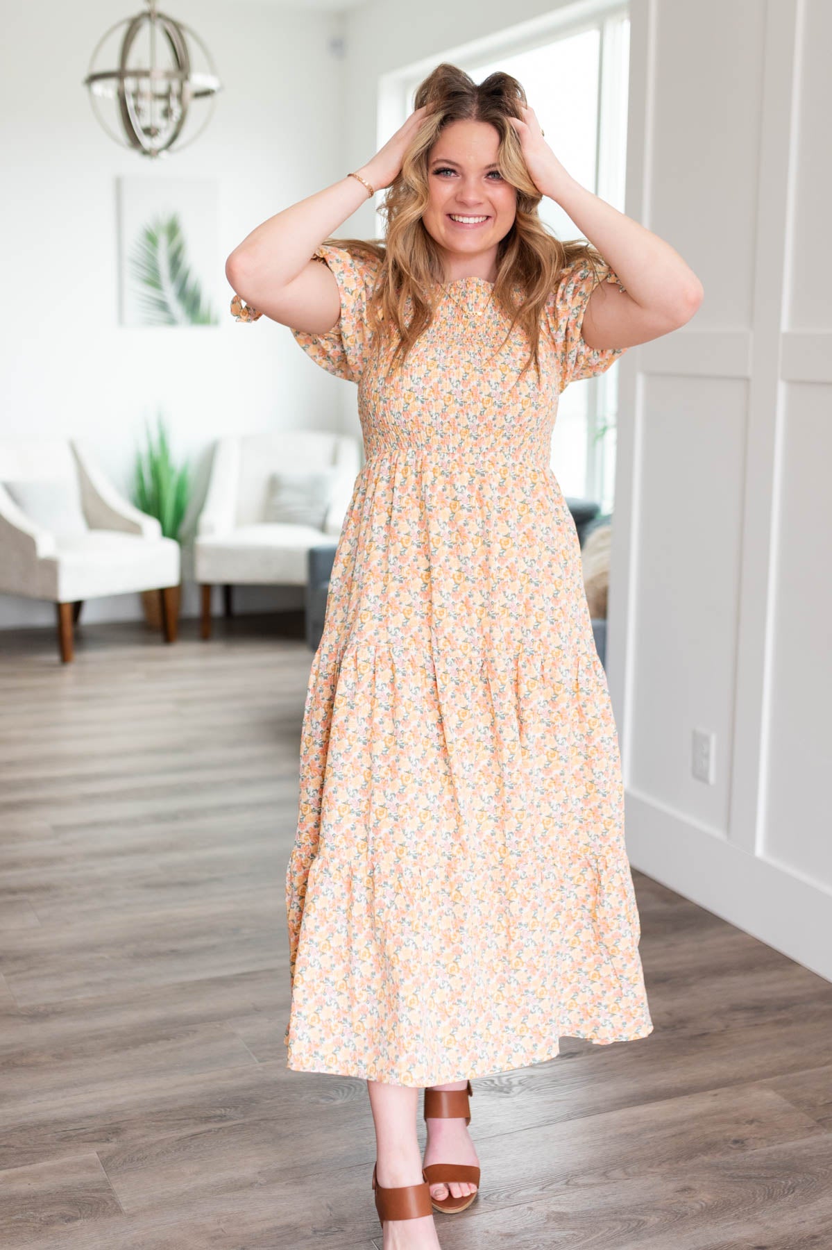 Short sleeve peach floral dress with smocked bodice and tiered skirt
