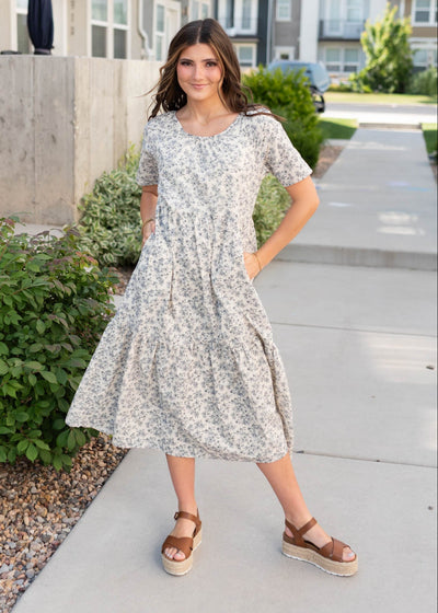 Navy flowers on the cream floral tiered dress with pockets