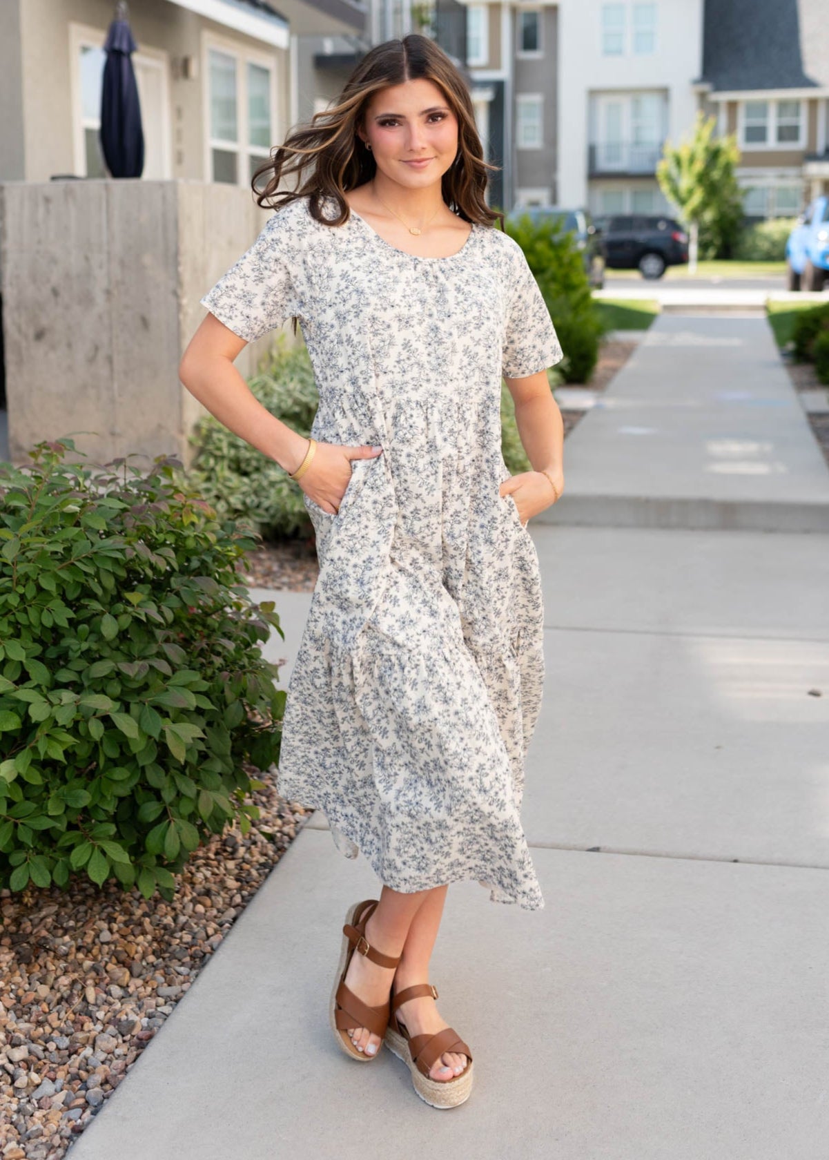 Cream floral tiered dress with pockets and short sleeves