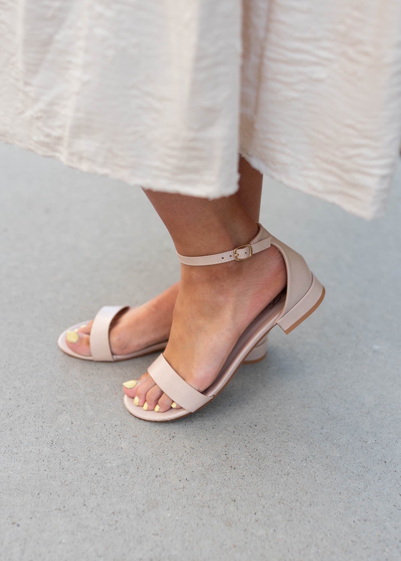 Side view of the beige dress shoes