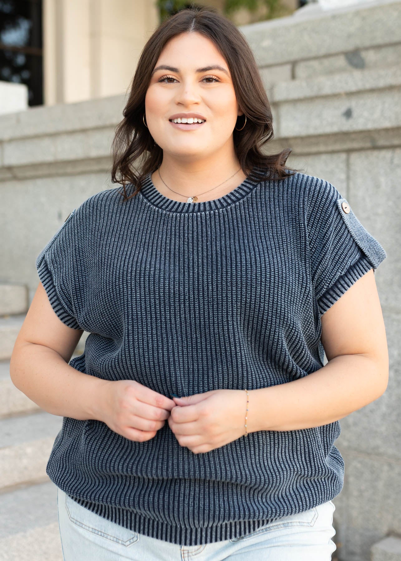 Plus size short sleeve navy knit sweater with a button on the sleeves